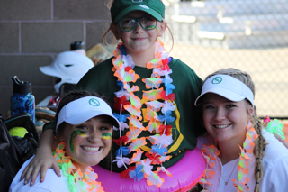 FNU players Olyvia Goebel and Danika Lagodzinski pose for a picture with Zoey Bergman.