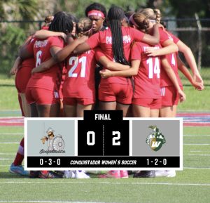 FNU women's soccer players in a huddle before a game.