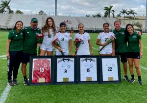 FNU 2023 seniors Hucely Hernandez, Mickaela Crespo Calisto, Valentina Salvatierra and Lauren Rodriguez pose with coaching staff for senior day celebration.