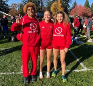 Cross Country runners Kristian Bodden, Christina Adams and Daryl Quichimbo.