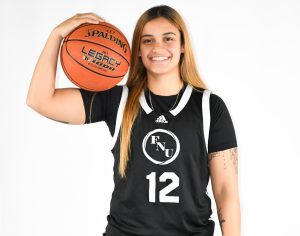 FNU basketball player Janelisse Marty Marrero holding a basketball.