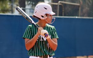 FNU softball player Gabi Obando holding a bat.