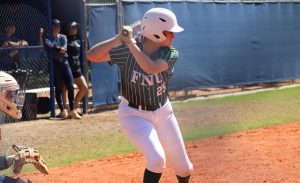 FNU softball player Heather Cuddy holding a bat.